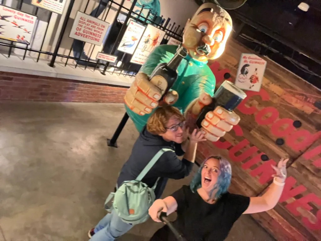 Larking about with the Gilroy toucan man statue in the Guinness advertising area, one of us grabbing the pint out of his hand