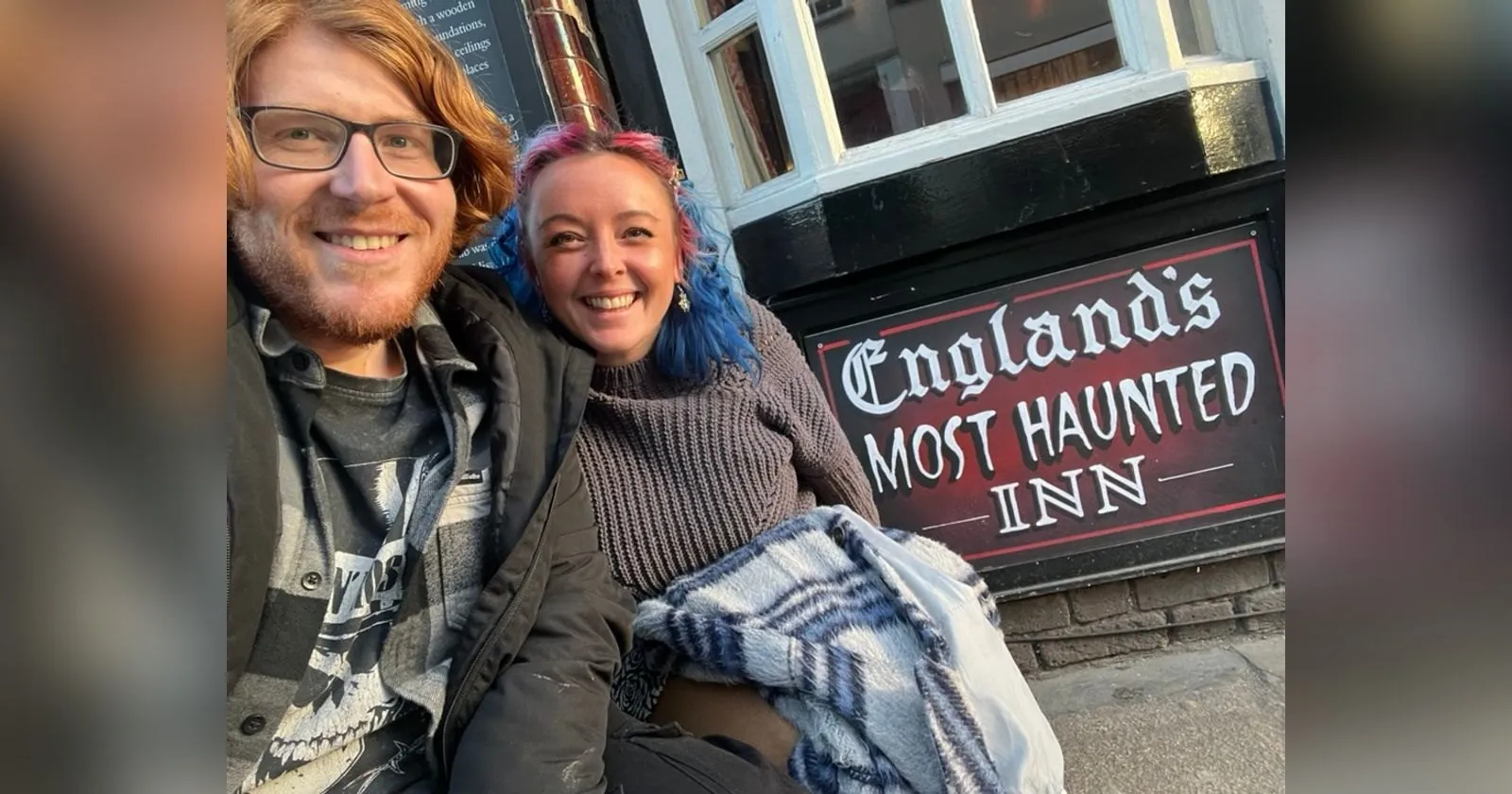 The two of us crouched on the pavement outside a black and white pub, grinning next to a red and black sign reading England's Most Haunted Inn