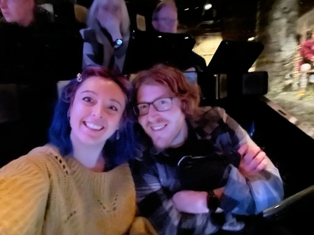 The two of us squeezed into a JORVIK time capsule, another couple in the capsule behind us and the reconstructed street lit up to the side